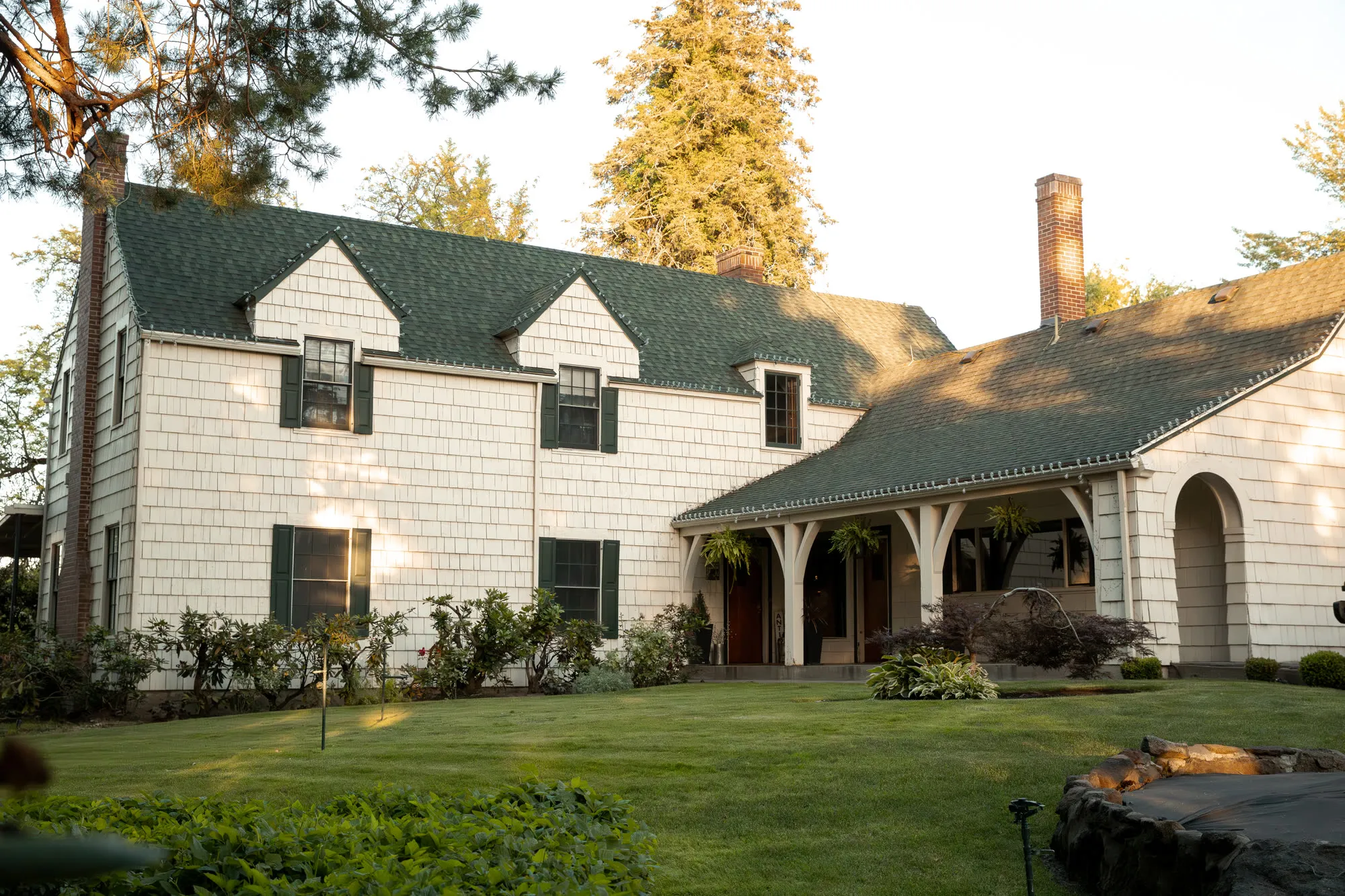 Full front of the 1929 house, dormers, and covered porch