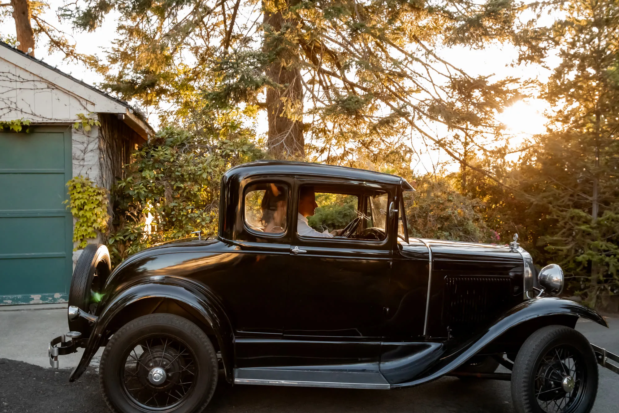 1930 Ford Model A parked beside the shingled house