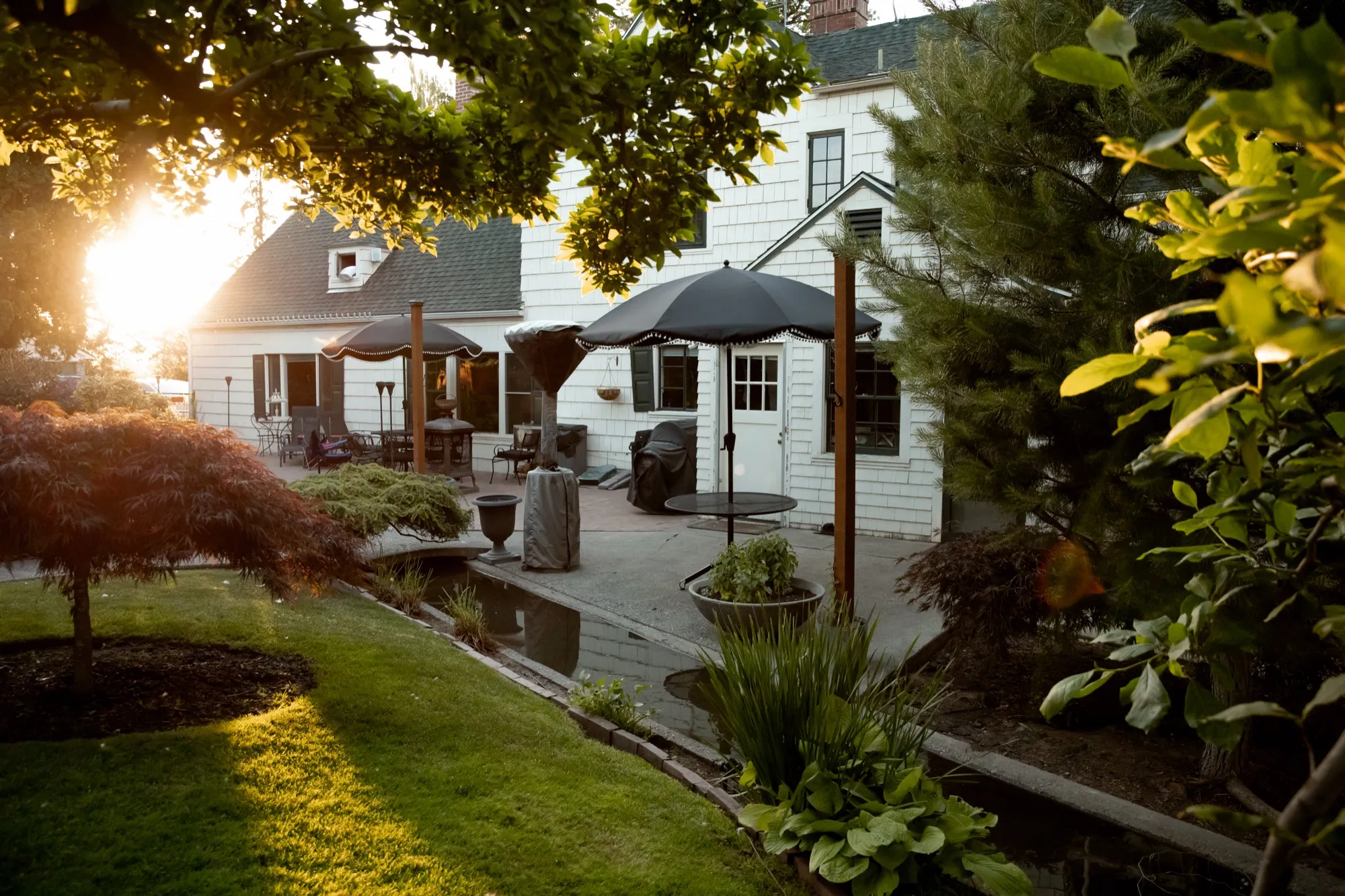 Patio and canal at sunset beside the house